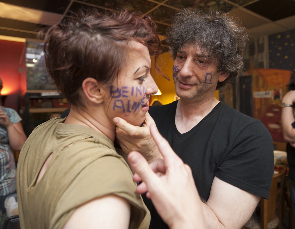 Neil writes Amanda's fear on her cheek. (Photo by Marc Lebryk)