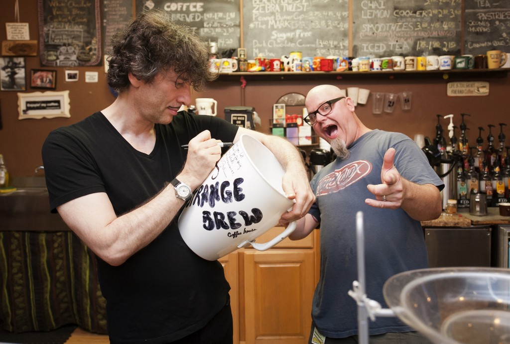 Neil autographs the giant Strange Brew mug, while a charismatic Dill looks on.